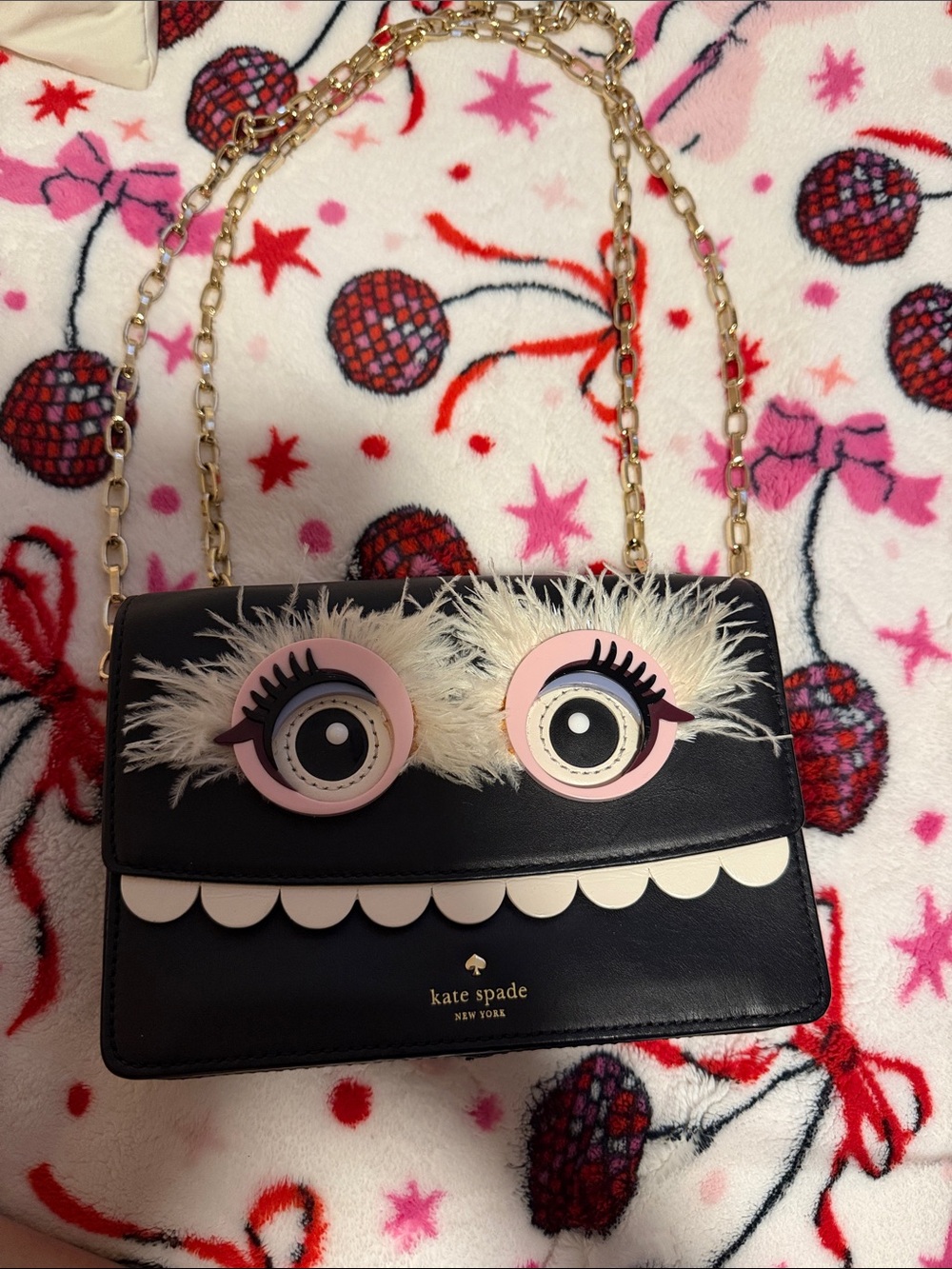 kate spade black leather novelty eye crossbody with gold chain